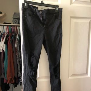 black jeans with holes at the knees